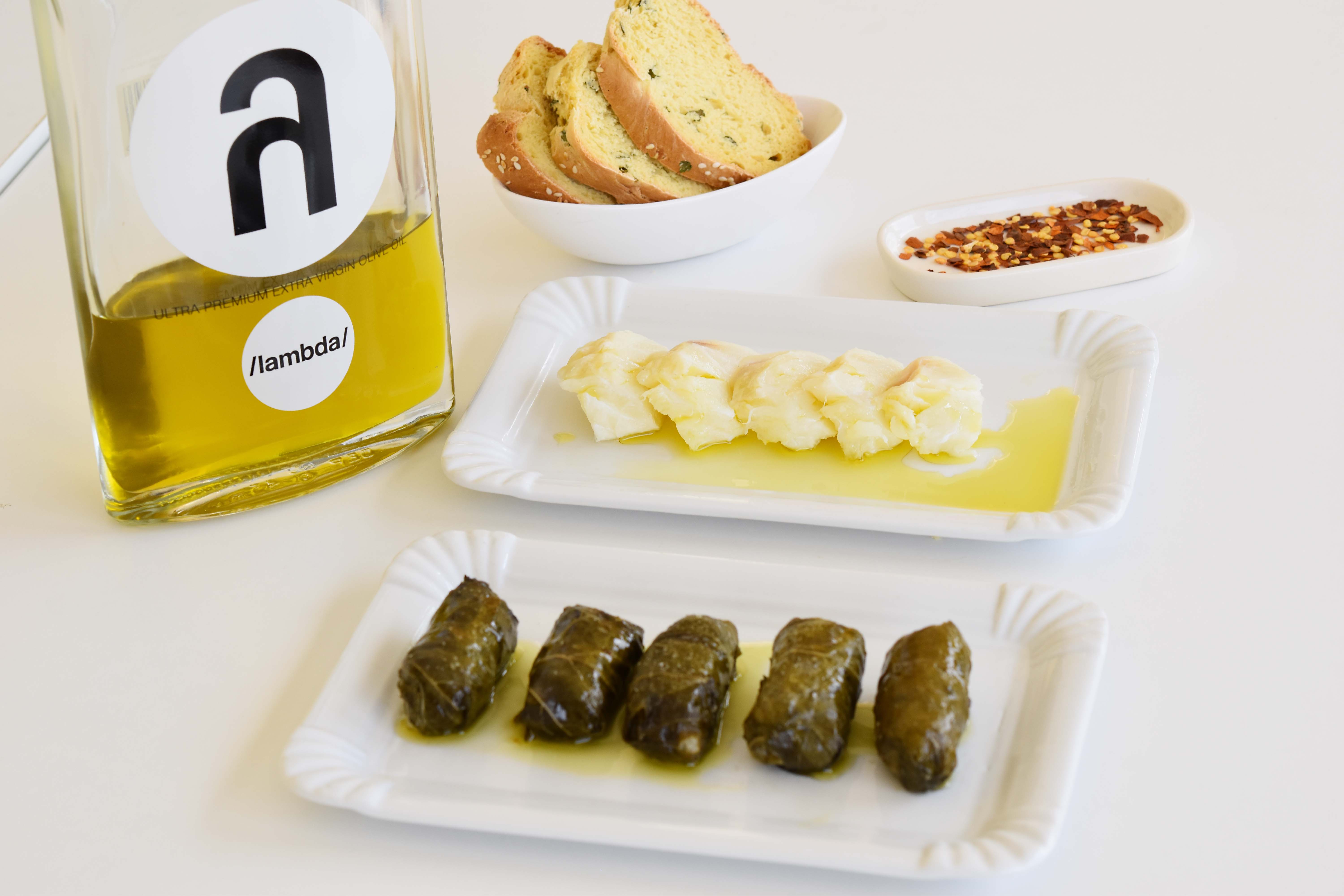 Fresh stuffed vine leaves (dolmadakia) with rice,cod and λ /lambda/ olive oil. Image